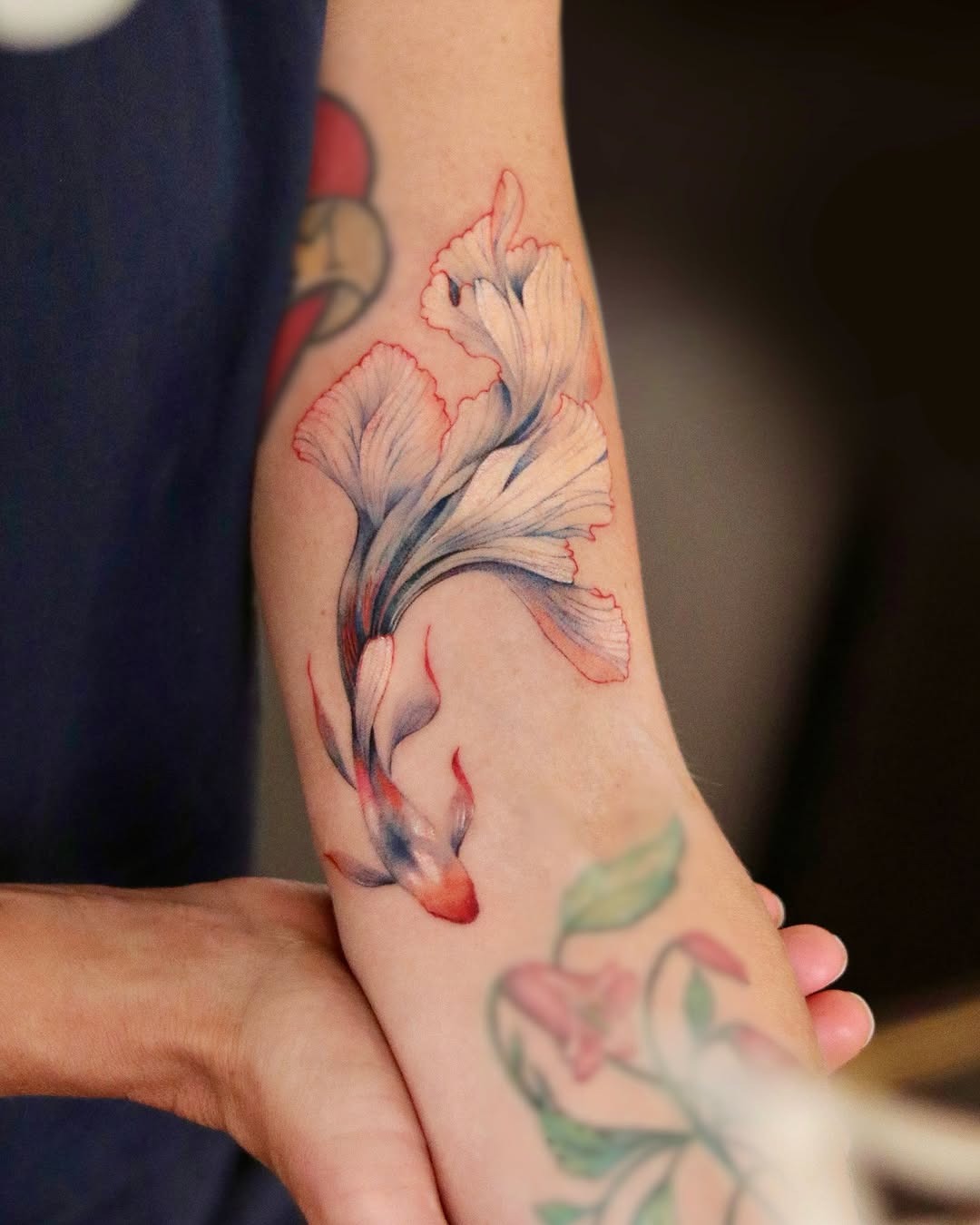 Stunning watercolor goldfish tattoo on the arm Tattoo Design