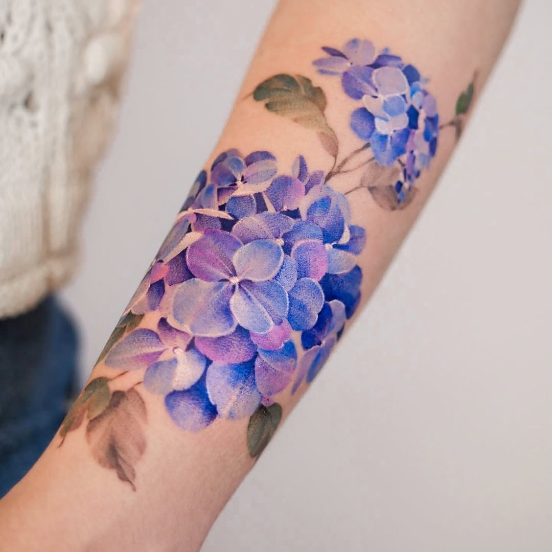 Vibrant lavender hydrangea watercolor tattoo on arm Tattoo Design