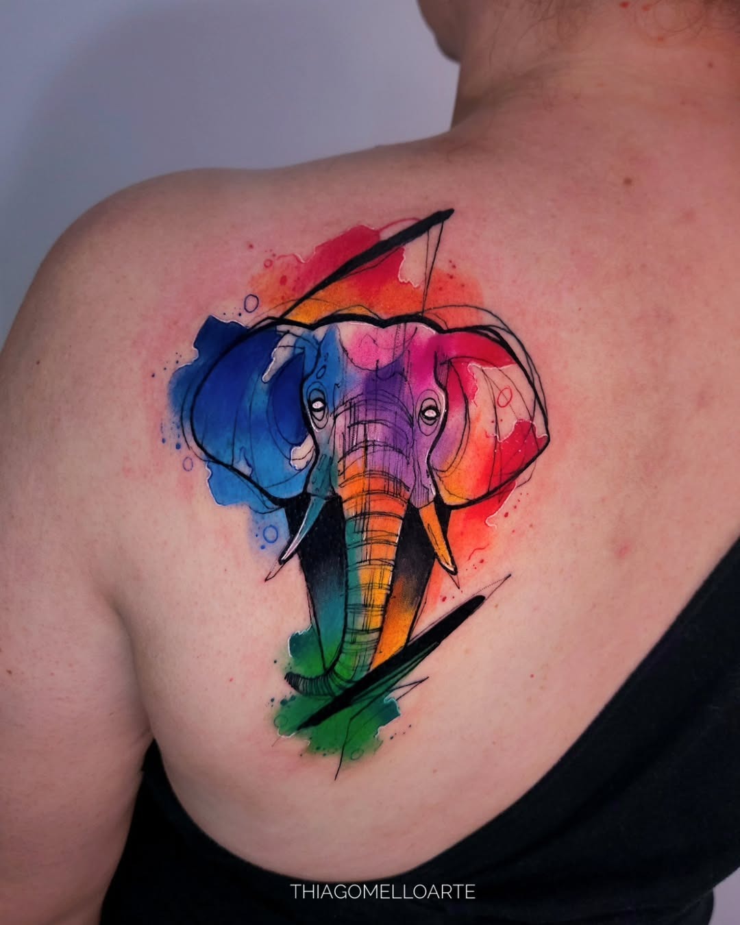 Vibrant watercolor elephant tattoo with bold hues Tattoo Design