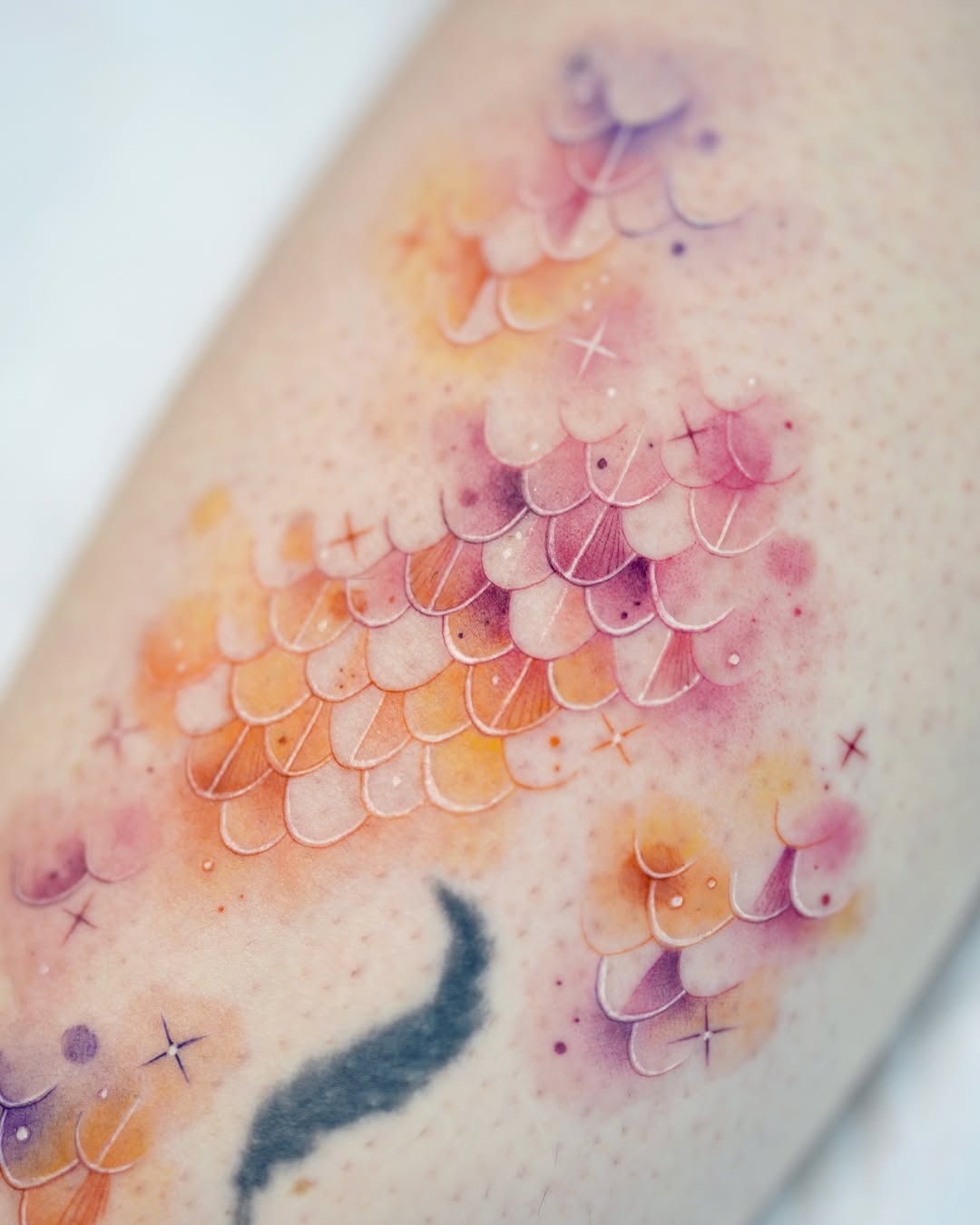Vibrant watercolor fish scale tattoo design Tattoo Design