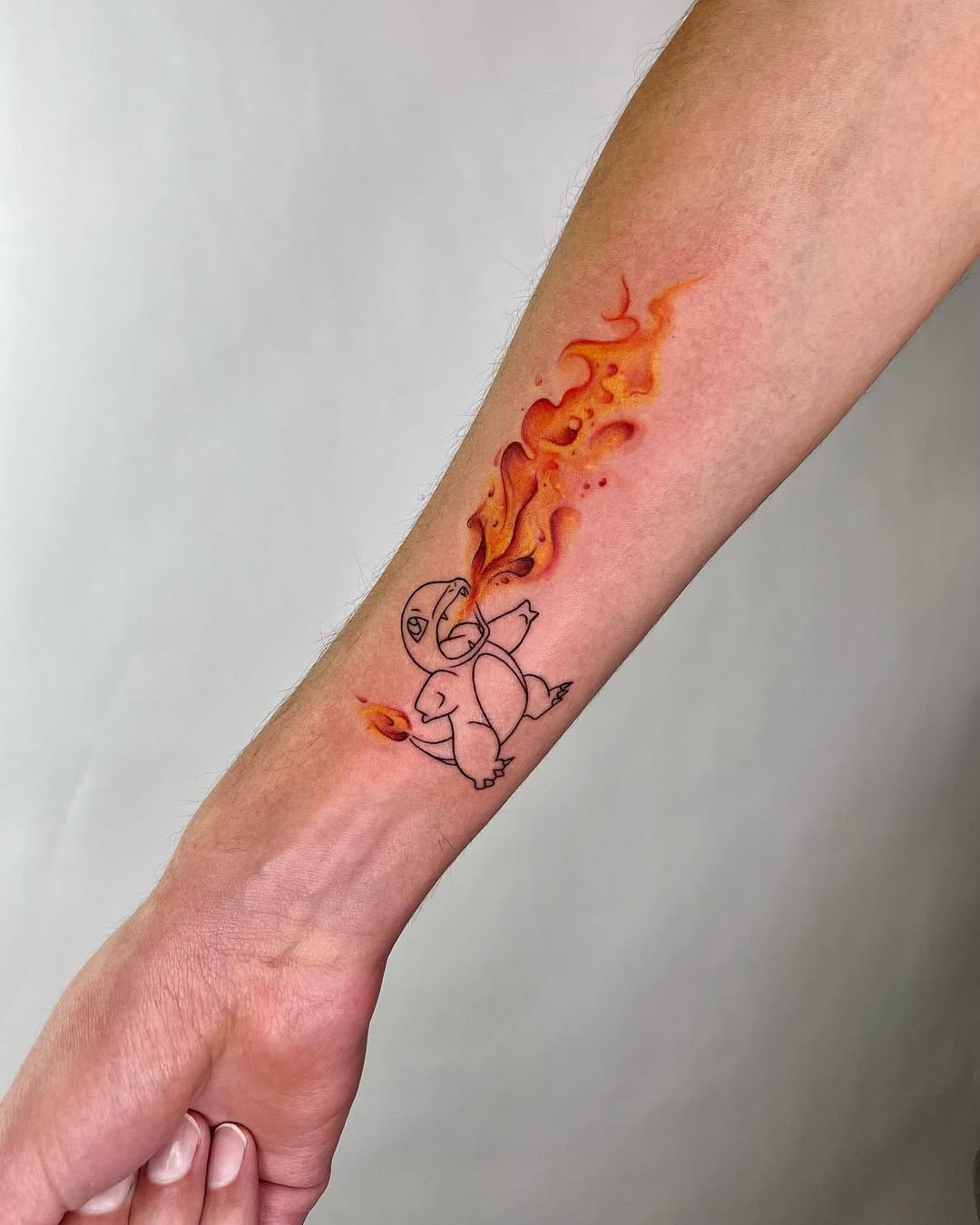 Vibrant watercolor flames surround a playful creature Tattoo Design