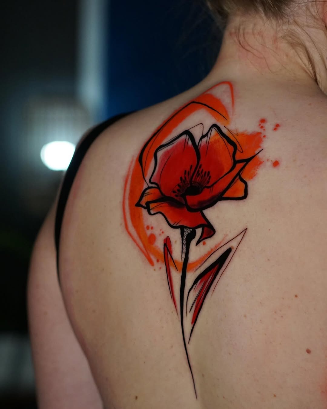 Vibrant watercolor flower tattoo on the back Tattoo Design