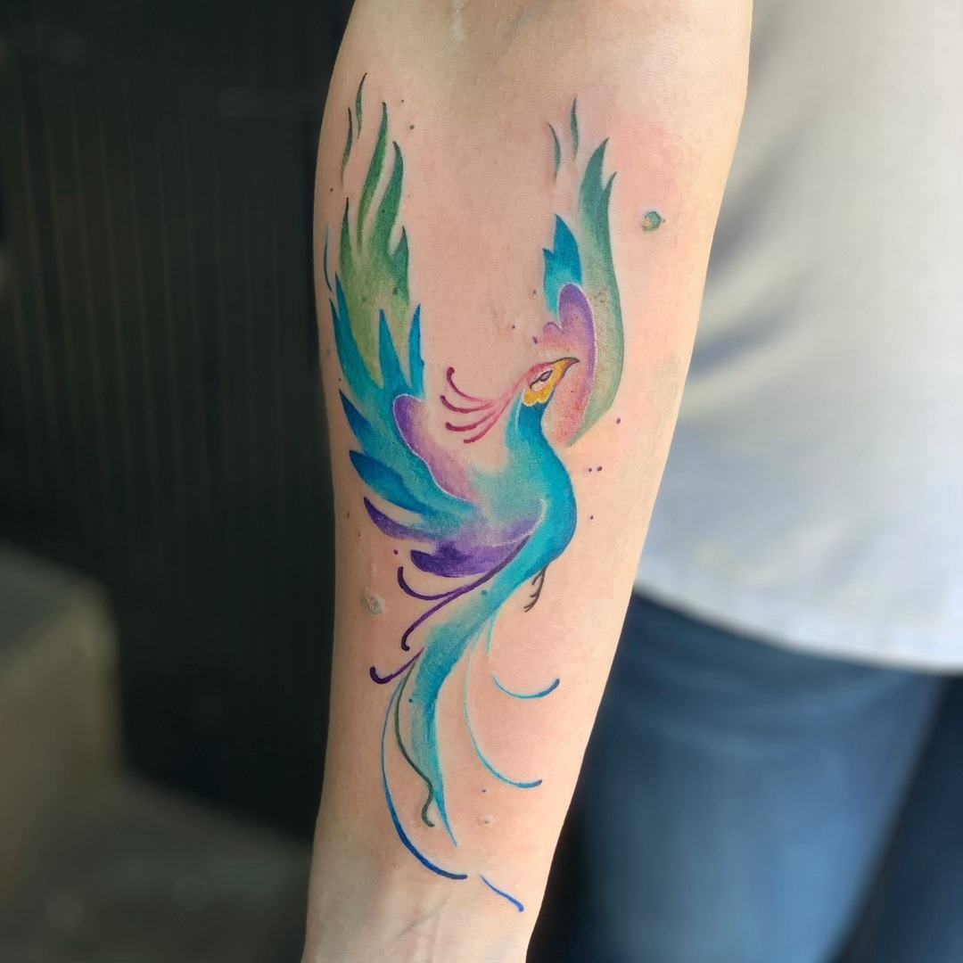 Vibrant watercolor phoenix tattoo in motion Tattoo Design