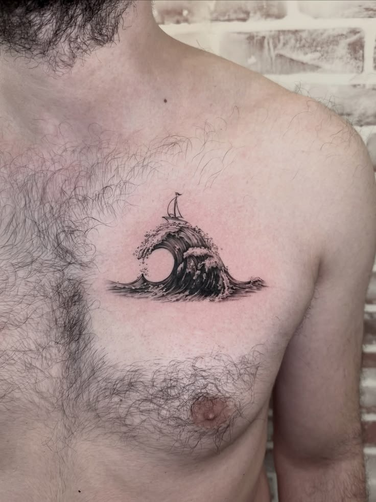 Dramatic Chest Wave and Sailboat Tattoo Tattoo Design