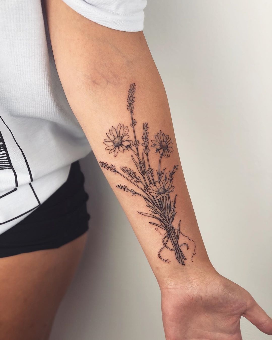 Bouquet-Inspired Wildflower Forearm Tattoo, a tattoo design rendered in clean detailed linework for the leg.