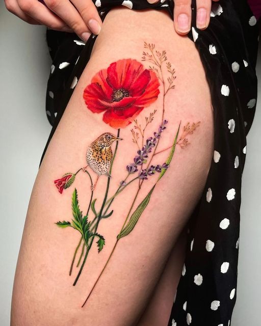 Bright Poppy and Bird Thigh Tattoo, a tattoo design rendered in bold for the hand.