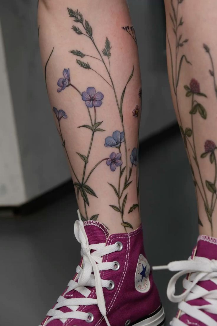Delicate Blue Wildflowers on the Leg, a tattoo design rendered in clean detailed linework for the hand.