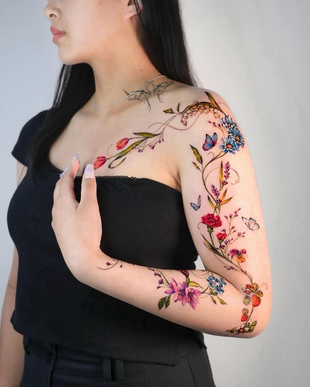 Full Arm Wildflower and Butterfly Sleeve, a tattoo design rendered in delicate fine-line for the shoulder.