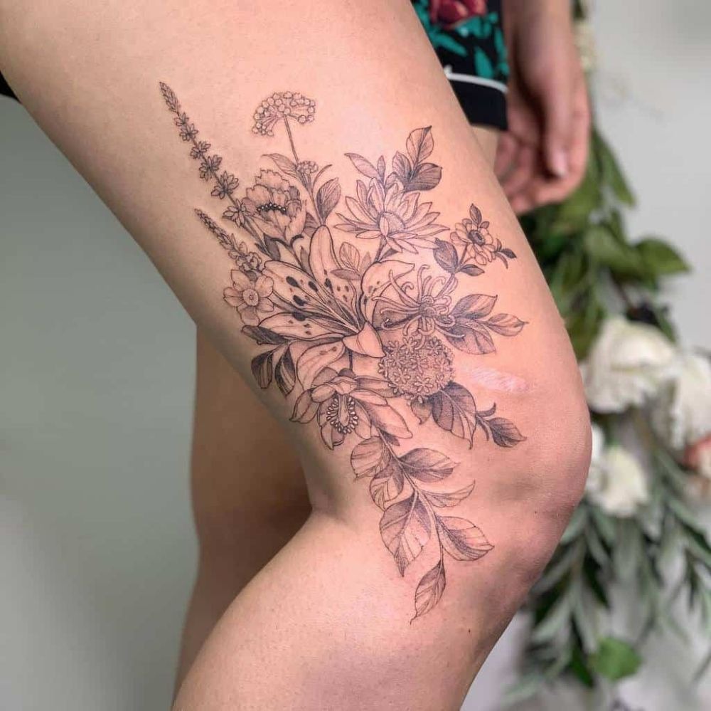 Large Black and Grey Floral Thigh Tattoo, a tattoo design rendered in bold.