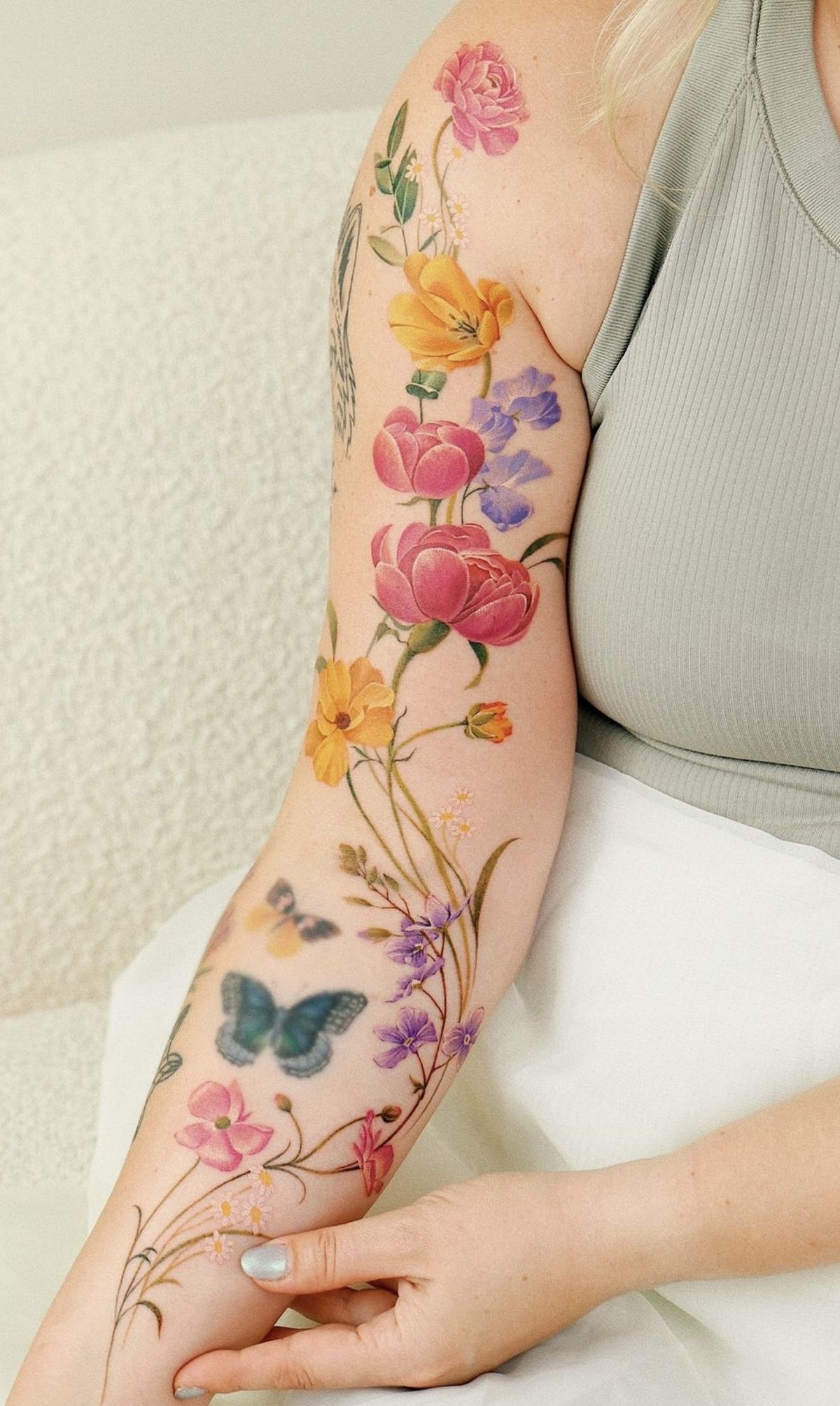 Vibrant Wildflower Sleeve, a tattoo design rendered in clean detailed linework for the shoulder.