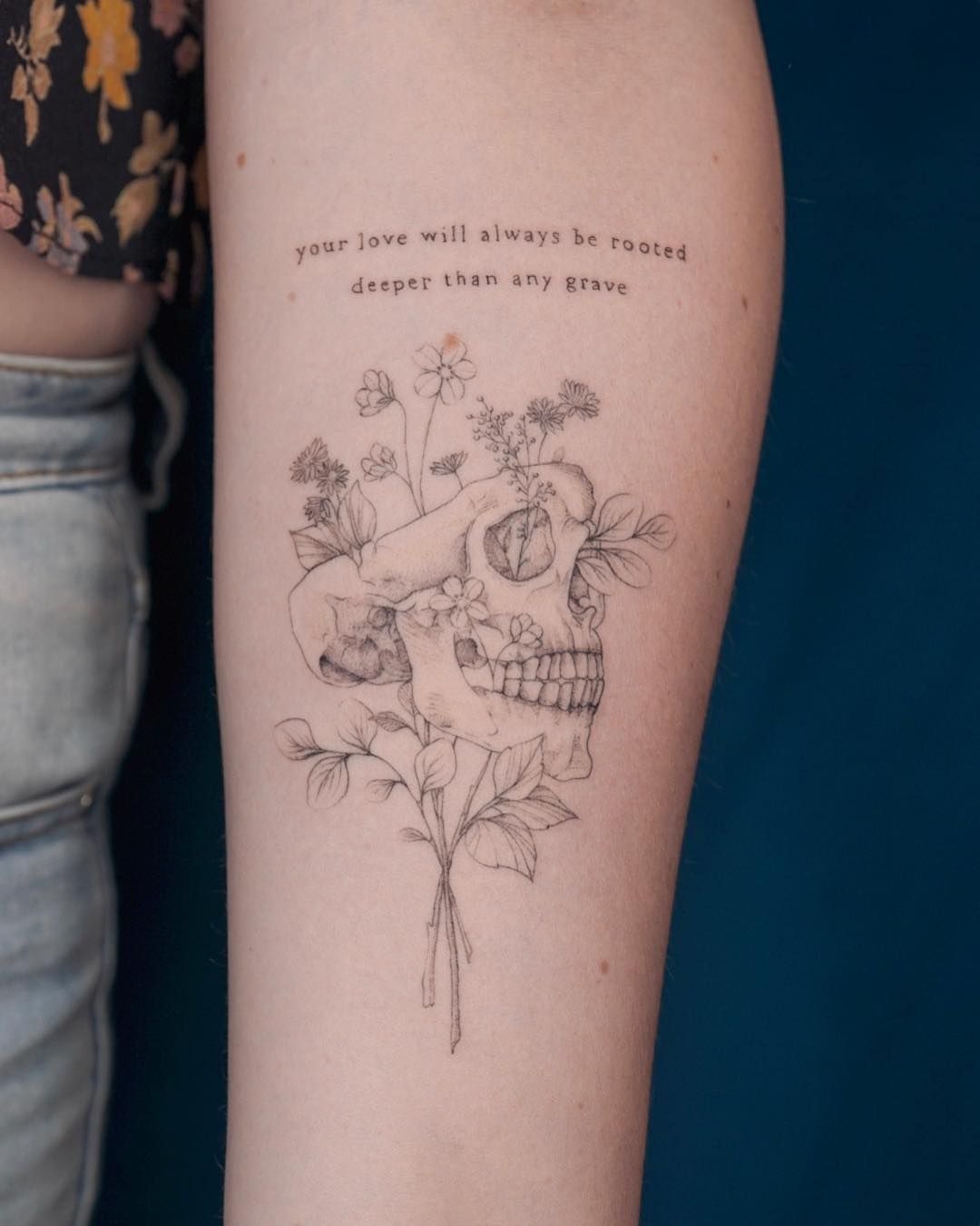 Wildflowers with Poetic Script, a tattoo design rendered in fine-line.
