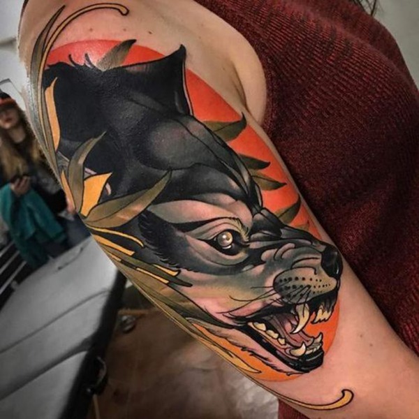 Snarling Silver Wolf against an Orange Sunset Tattoo Design