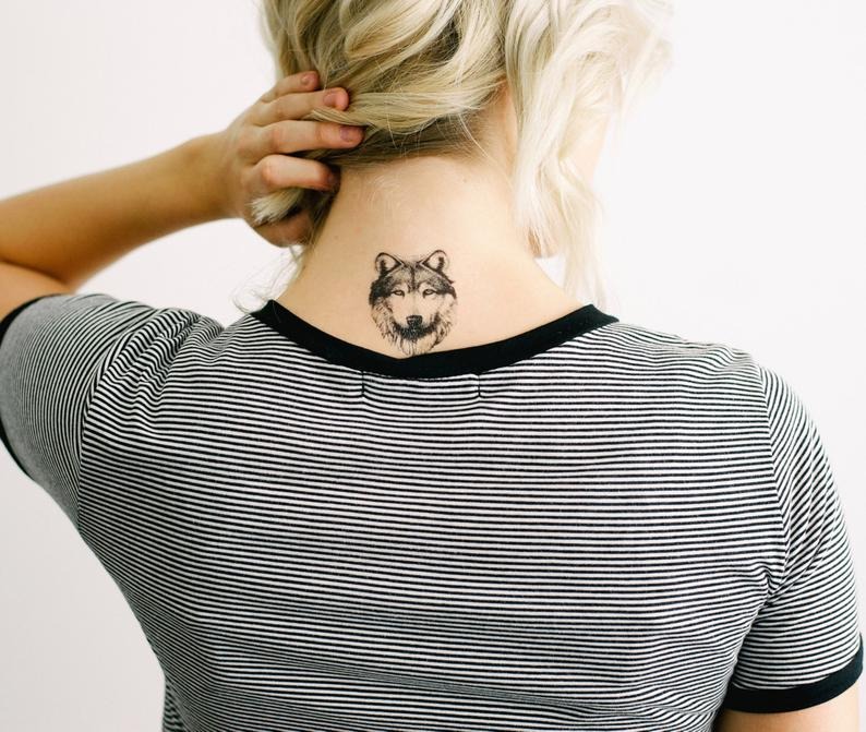 Symmetrical Wolf FaceNeck Tattoo Tattoo Design