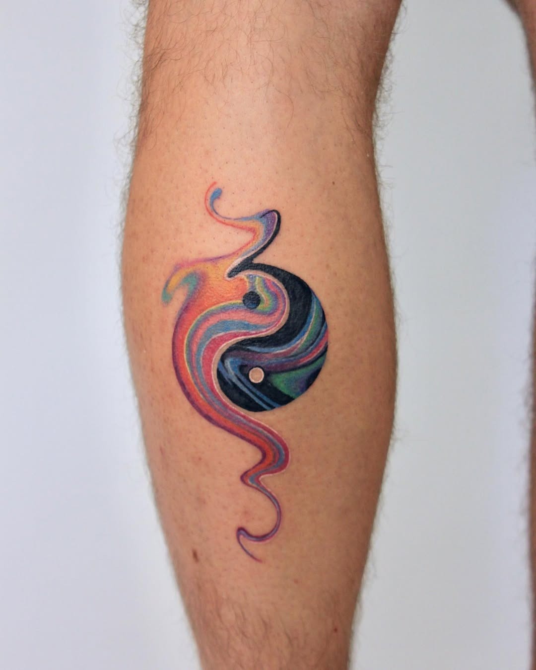 Artistic yin yang tattoo with colorful swirls Tattoo Design