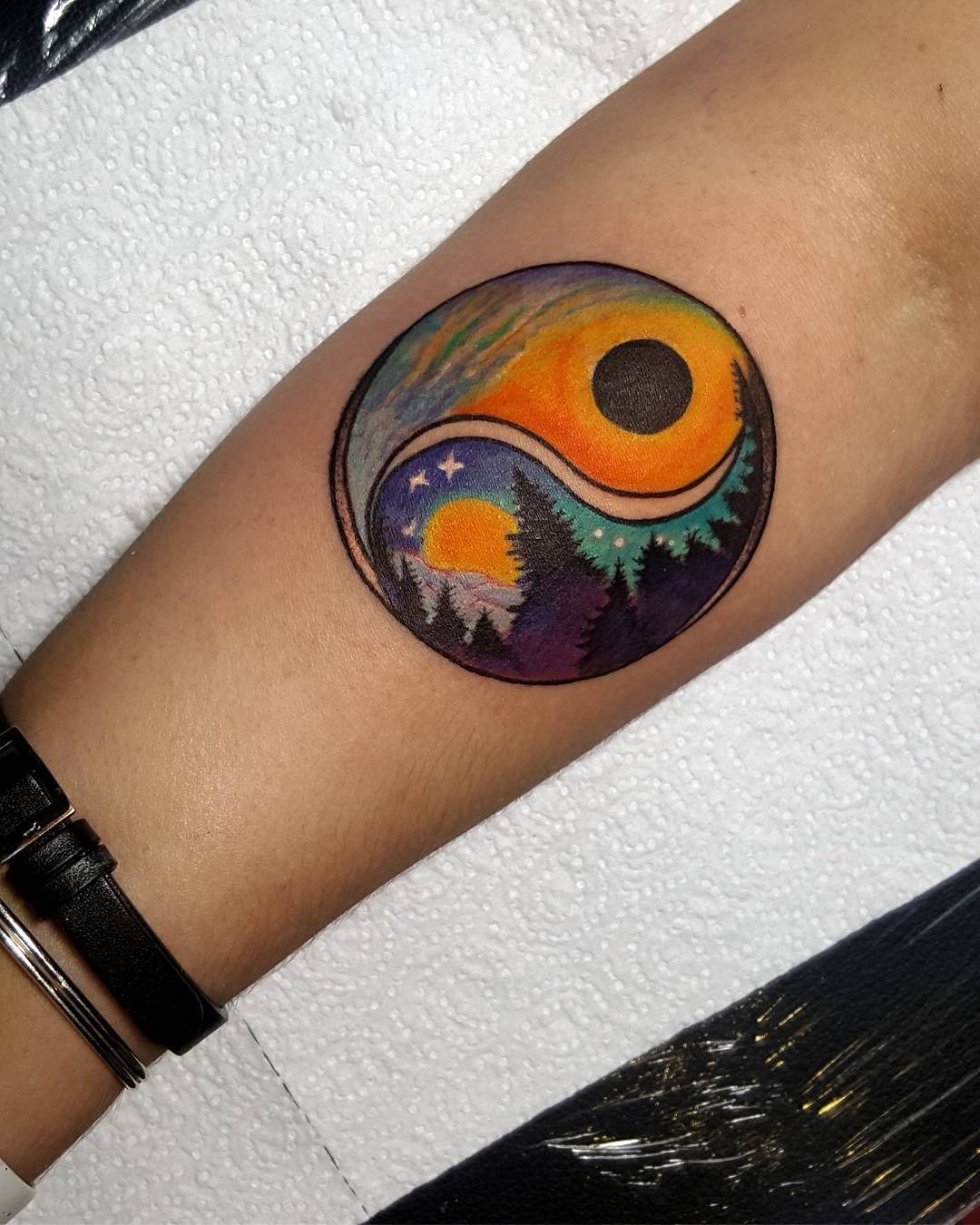 Nature-inspired yin yang tattoo with vibrant colors Tattoo Design