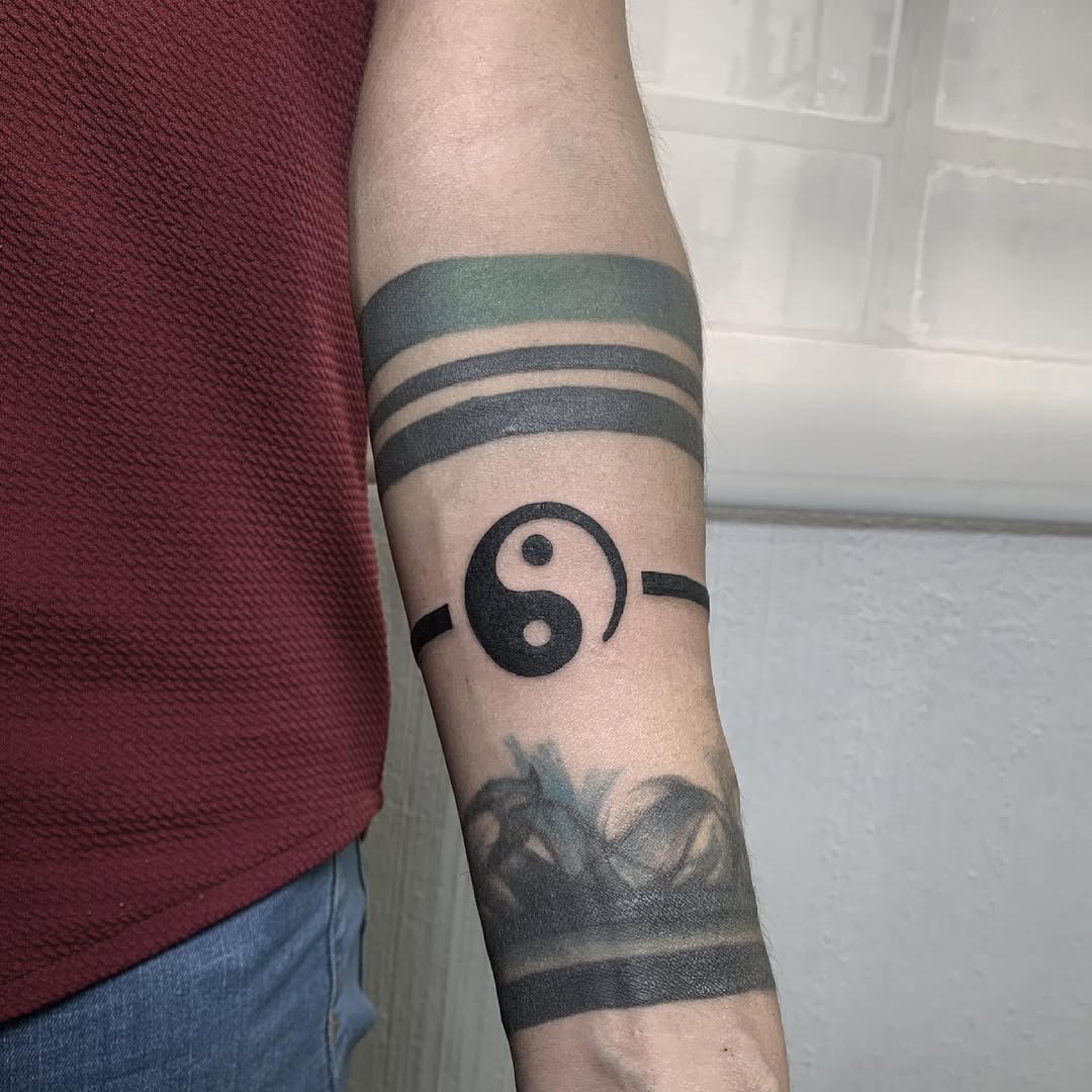 Stylish yin yang tattoo on a forearm Tattoo Design