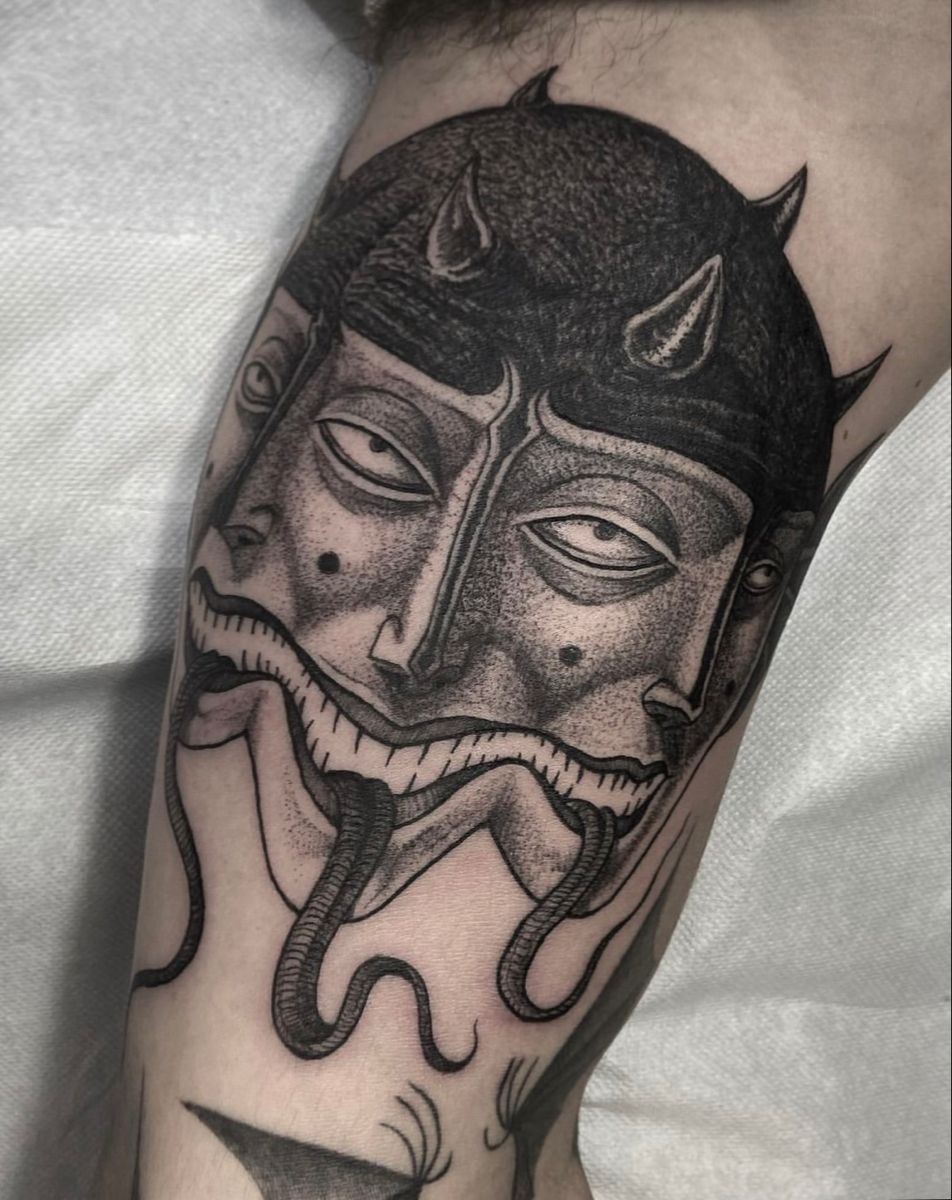 Double-Faced Horned Mask Tattoo Design