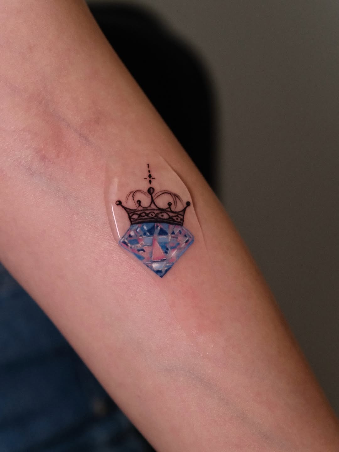 Elegant crown adorned diamond tattoo design Tattoo Design