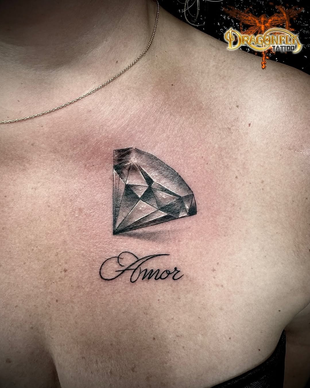 Elegant diamond tattoo with script lettering Tattoo Design