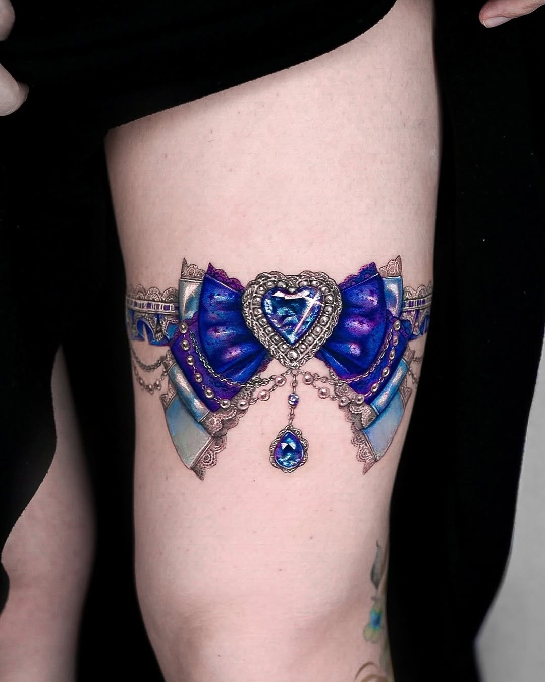 Exquisite bow-tie diamond tattoo on thigh Tattoo Design