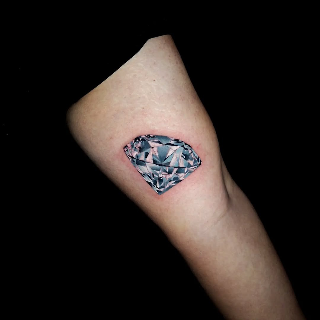 Stunning diamond tattoo on the elbow Tattoo Design