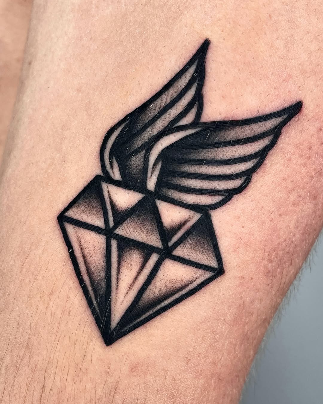 Stylish diamond tattoo with intricate wing detail Tattoo Design