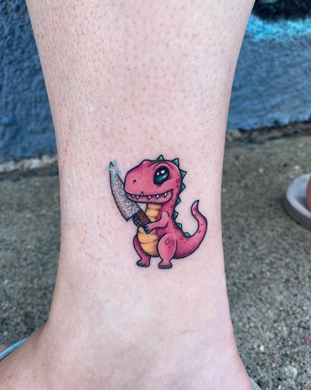 Pink T-Rex With Sparkling Sword Tattoo Design