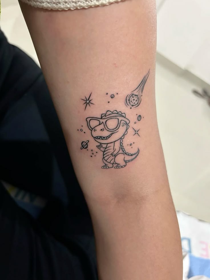 Tiny Space Dinosaur With Sunglasses Tattoo Design