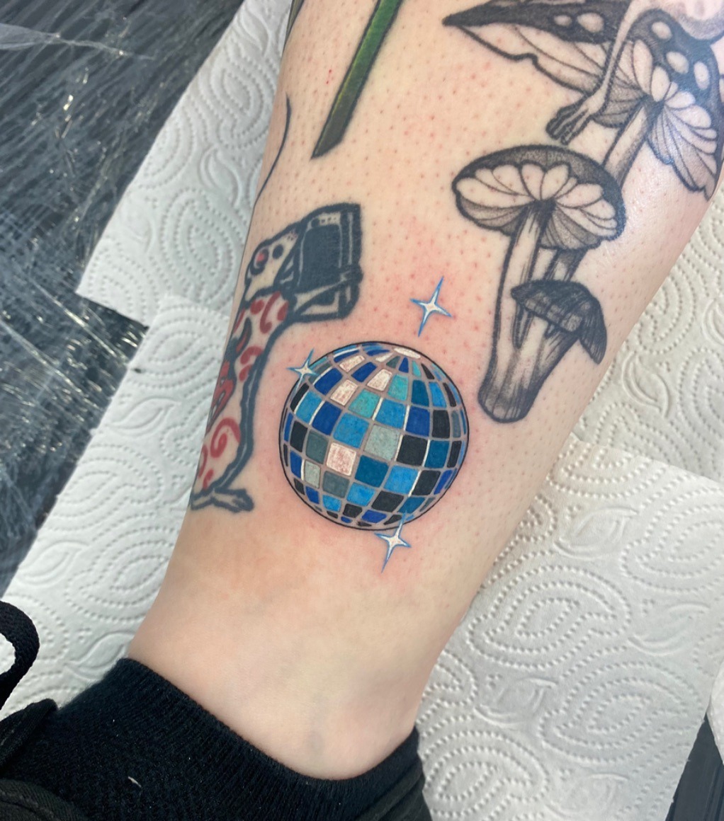 Chic disco ball tattoo with vibrant colors Tattoo Design