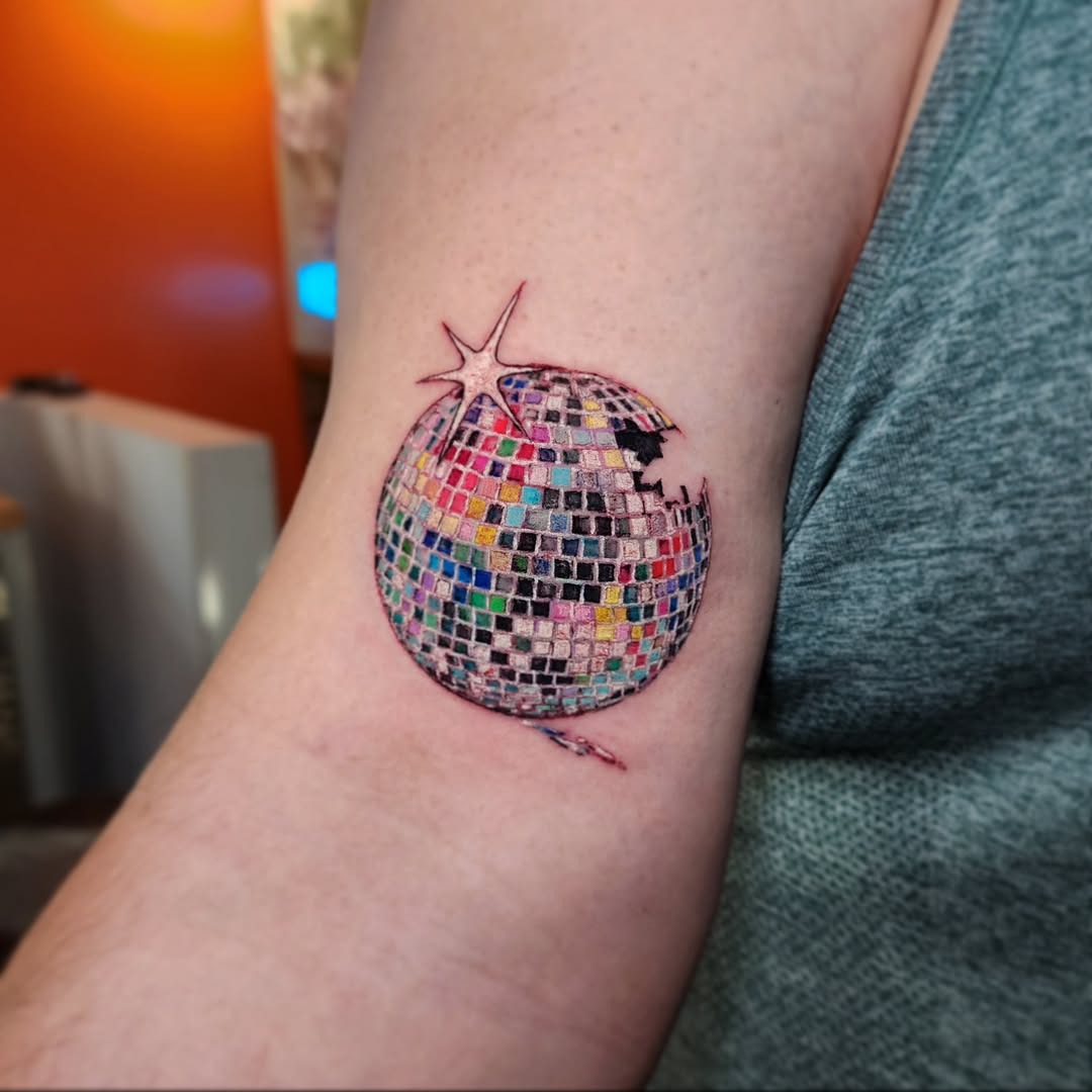 Colorful disco ball tattoo on the arm Tattoo Design