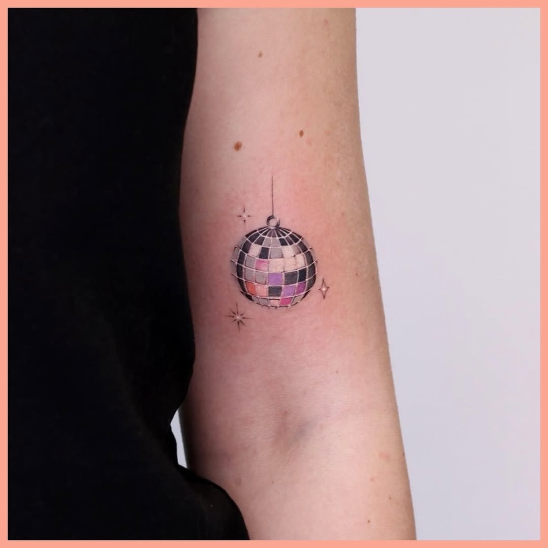 Colorful disco ball tattoo with sparkling accents Tattoo Design