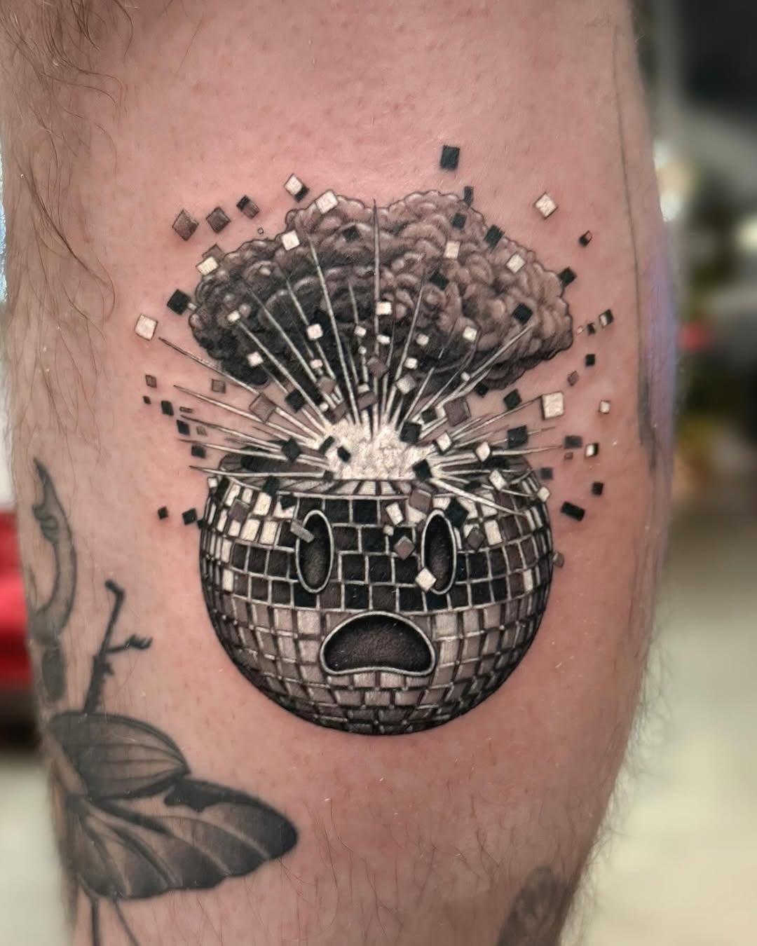 Unique explosion-themed disco ball tattoo design Tattoo Design