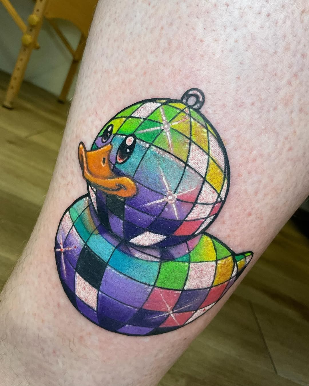 Vibrant disco ball duck tattoo with playful charm Tattoo Design