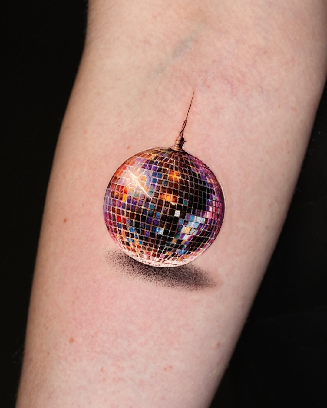 Vibrant disco ball tattoo capturing party vibes Tattoo Design