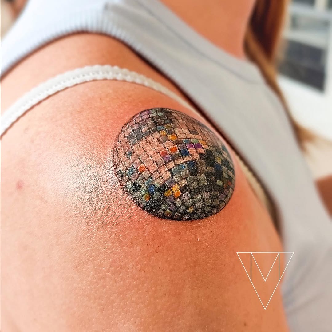 Vibrant disco ball tattoo on shoulder Tattoo Design