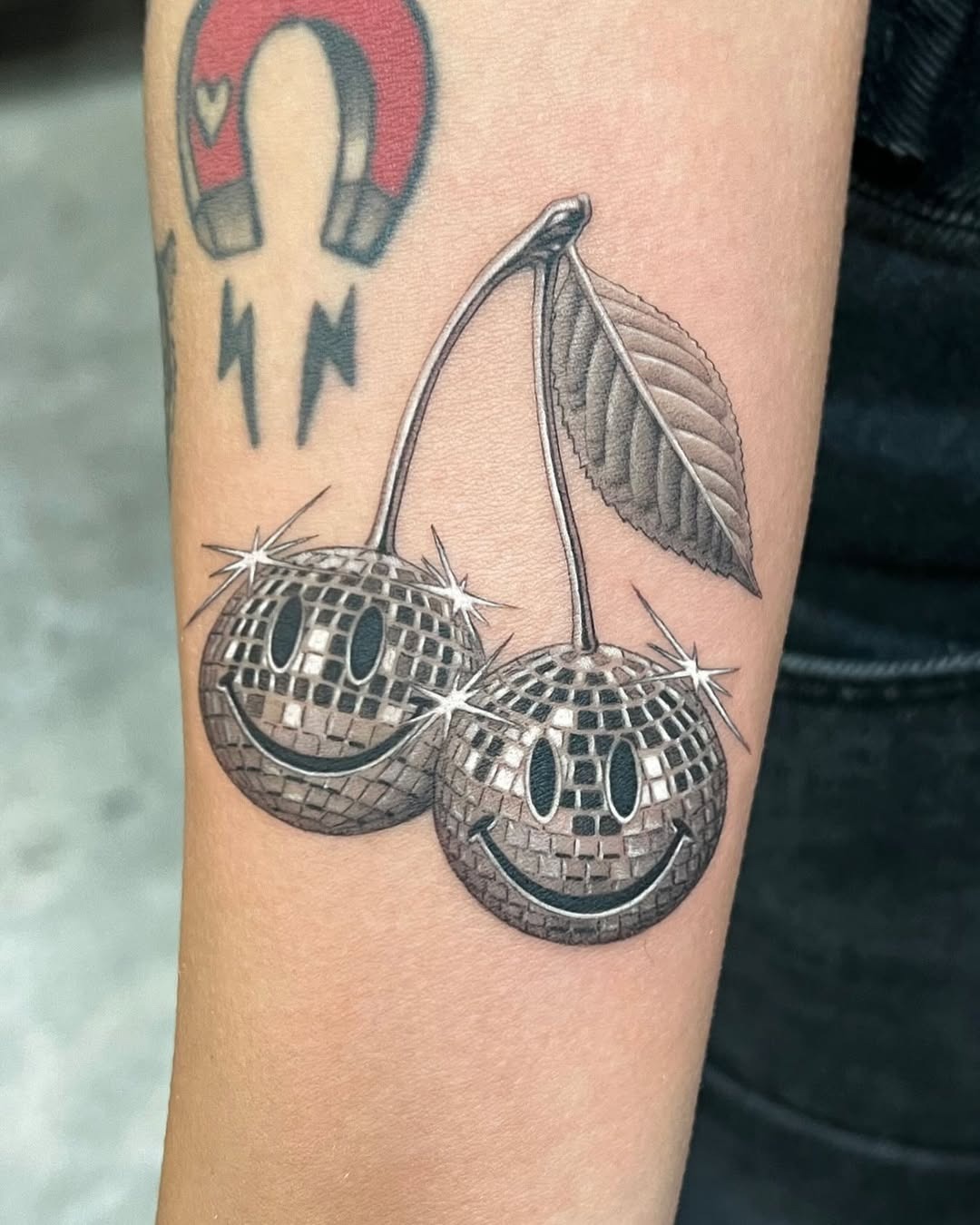 Whimsical cherries with disco ball charm Tattoo Design