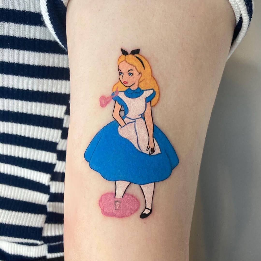 This Alice in Wonderland tattoo captures the essence of whimsy and curiosity.