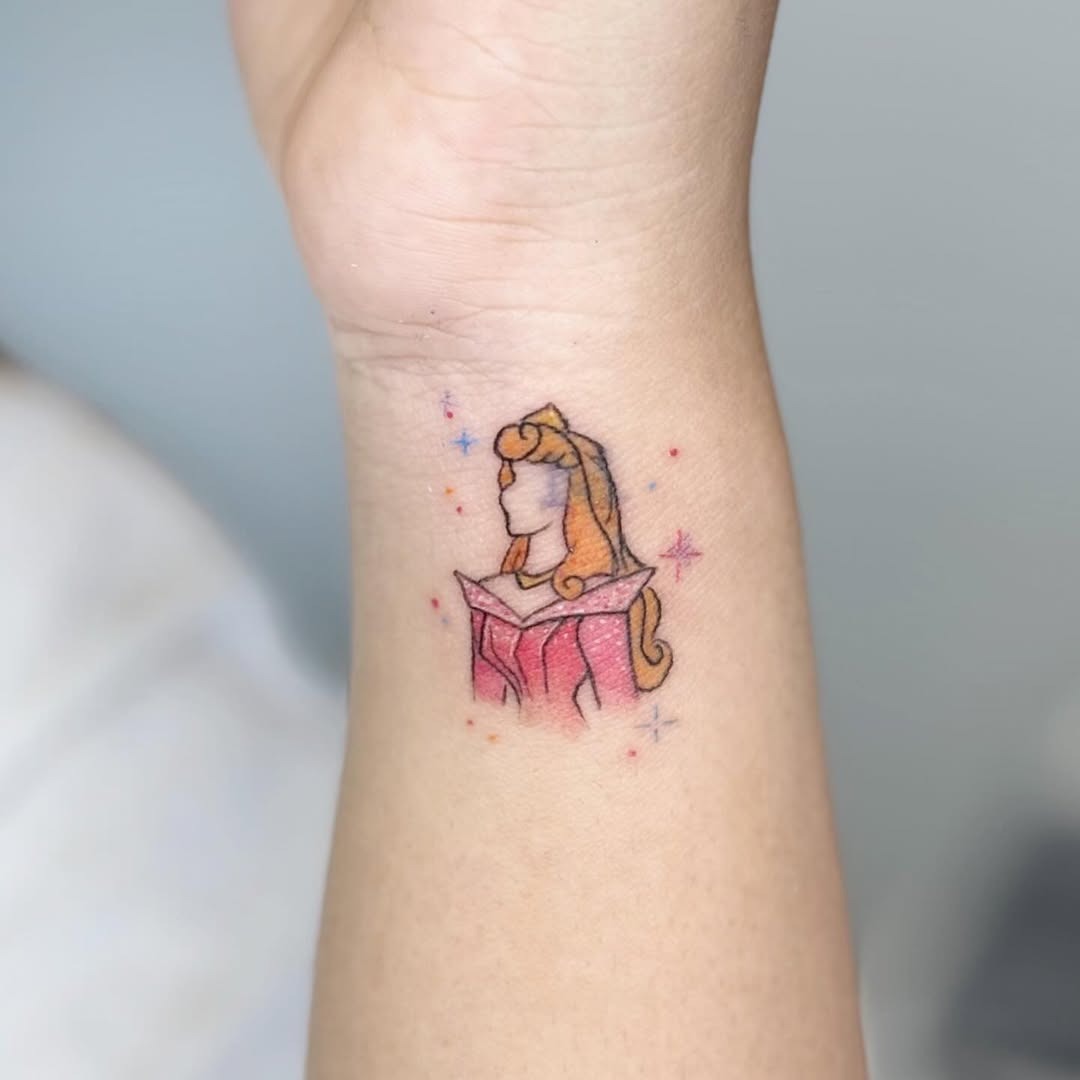 This enchanting tattoo features Aurora, the beloved Disney princess, captured in a colorful design.