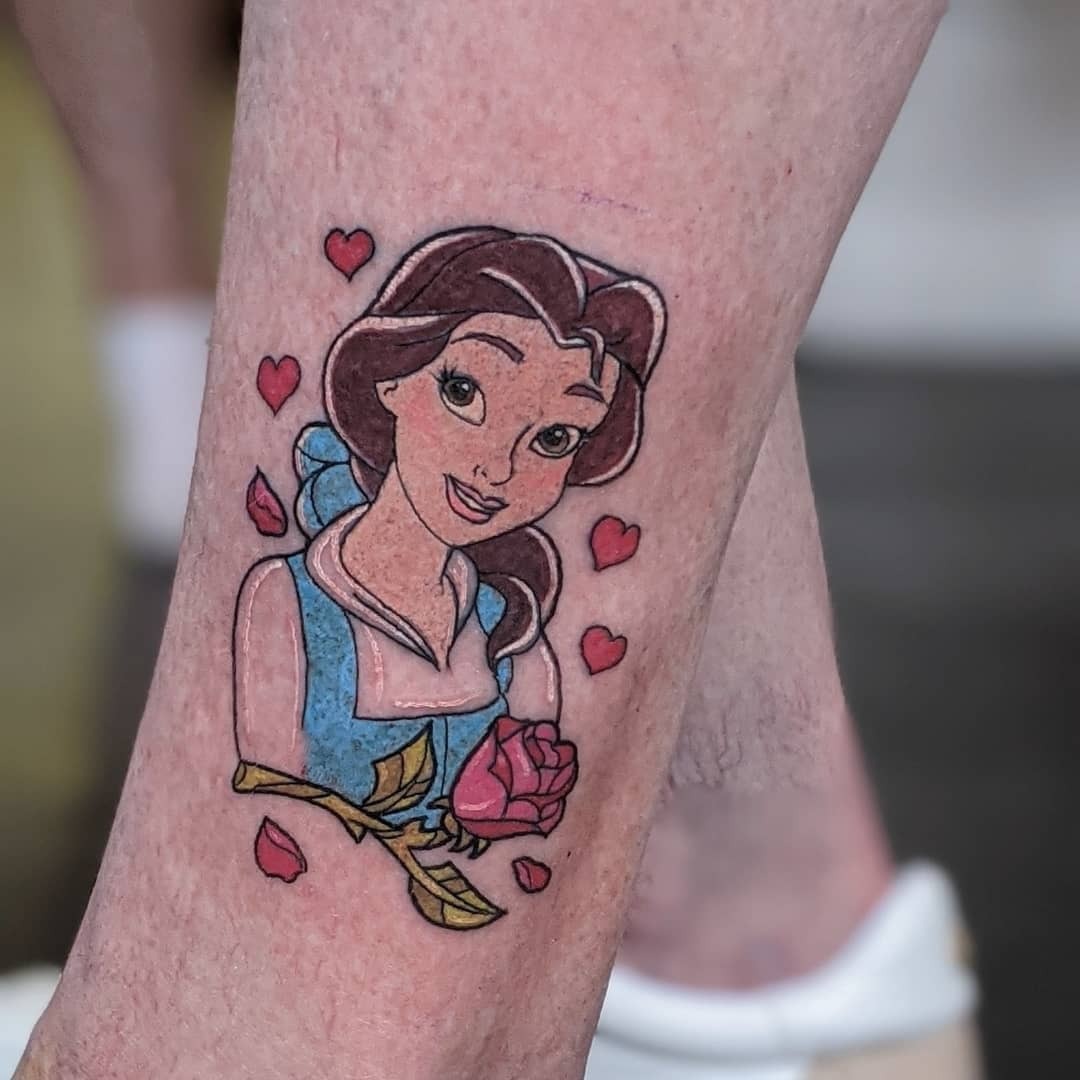 This tattoo features Belle, surrounded by whimsical hearts and a rose.