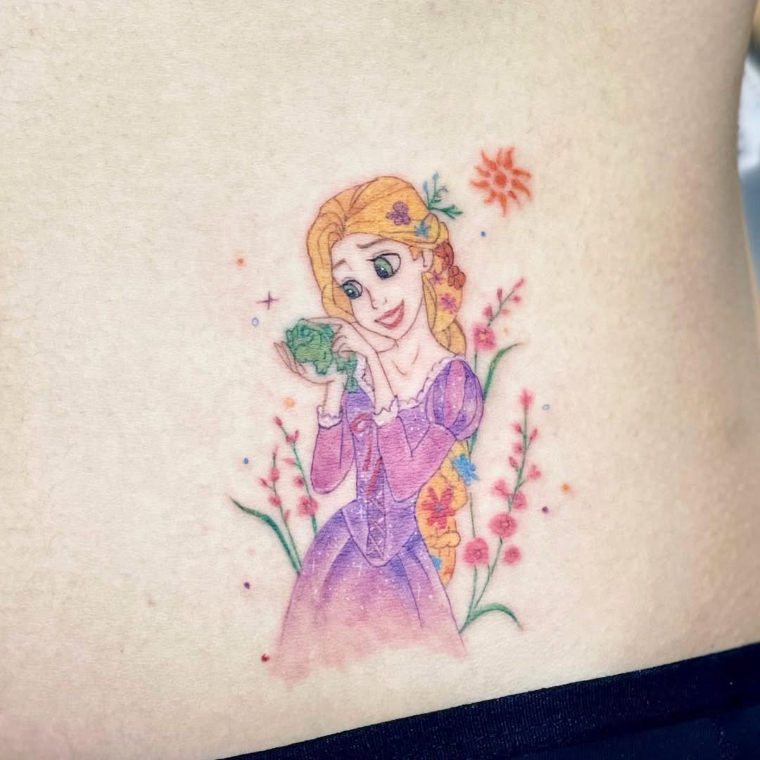 This tattoo features a whimsical depiction of Rapunzel holding a frog, surrounded by colorful flowers.