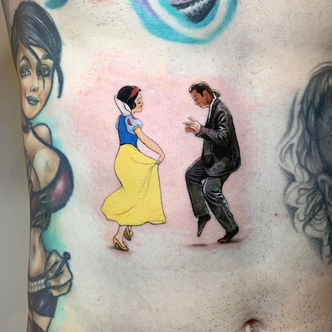 This tattoo captures the enchanting moment of Snow White dancing with her prince.