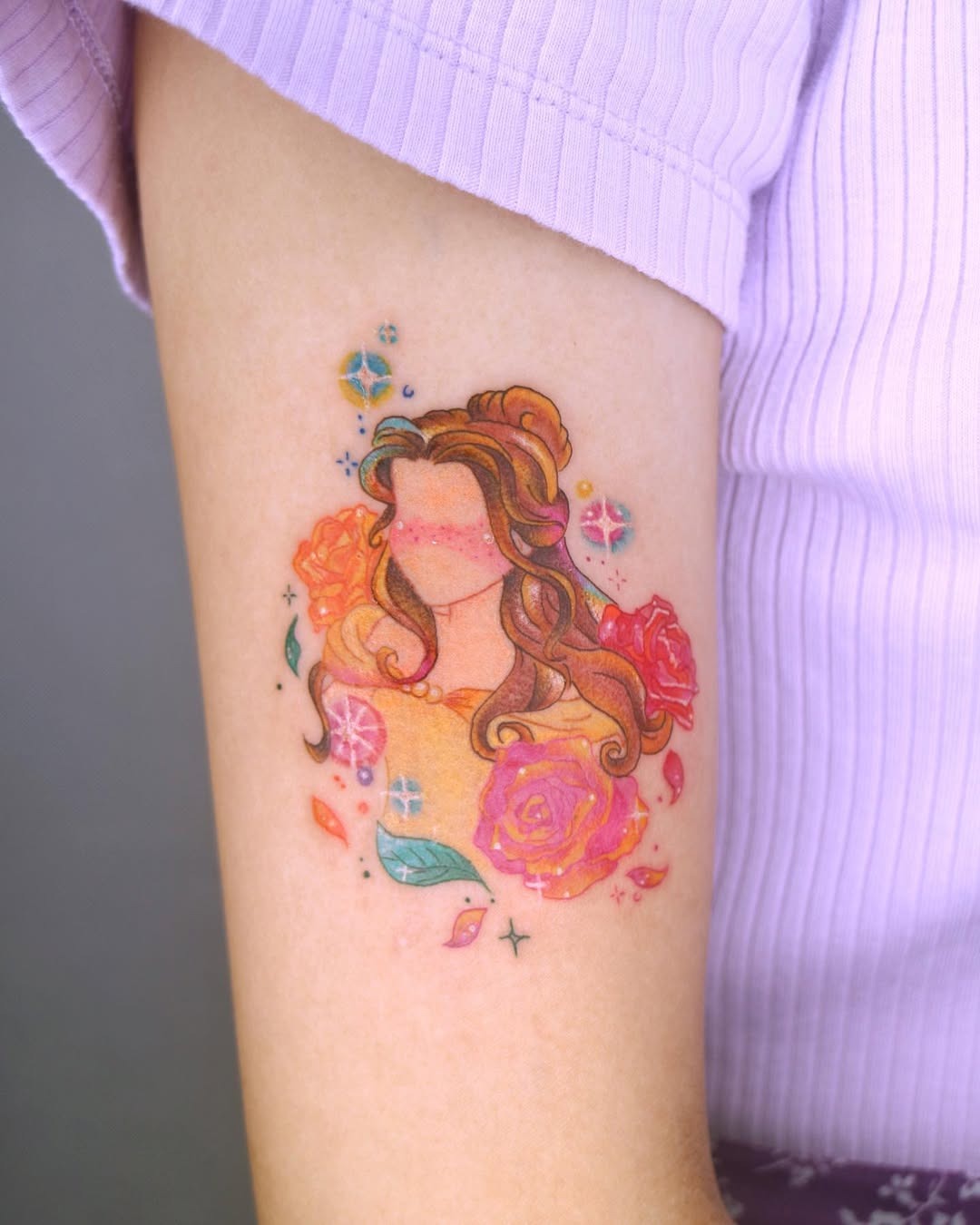 This tattoo beautifully depicts Belle from Disney's 'Beauty and the Beast'.