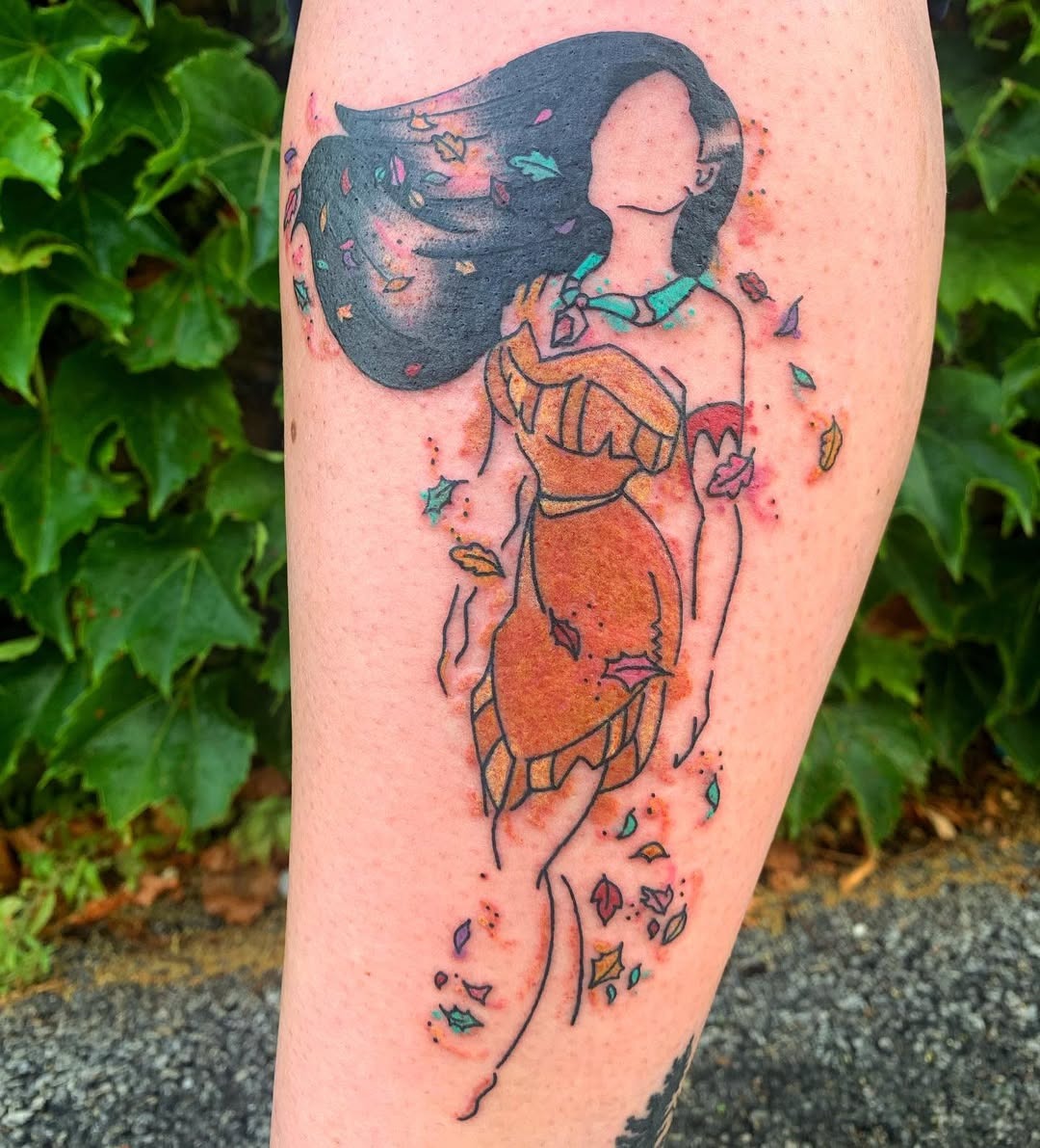 This tattoo features a stunning rendition of Pocahontas surrounded by swirling leaves.