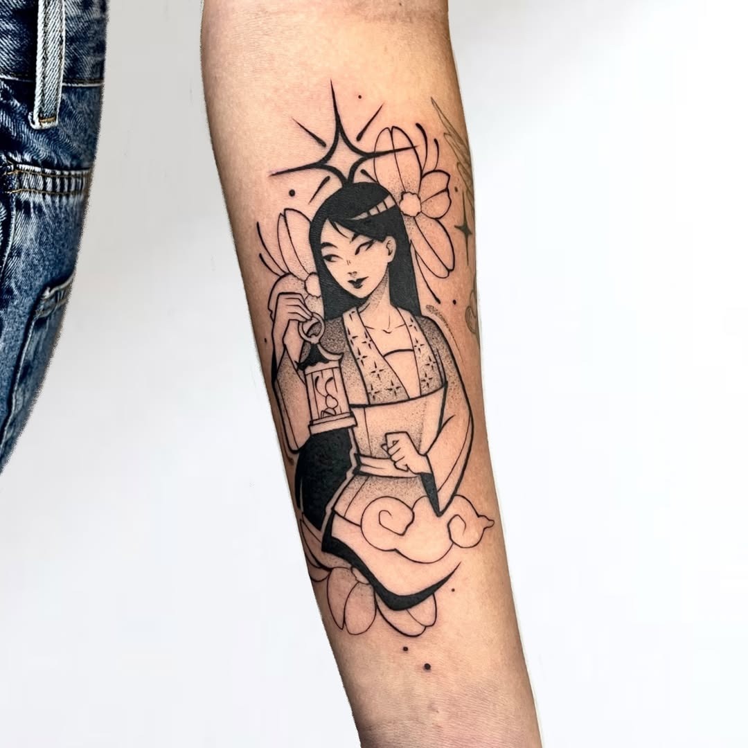 This tattoo features a beautifully designed Mulan, showing her in traditional attire with delicate floral elements.