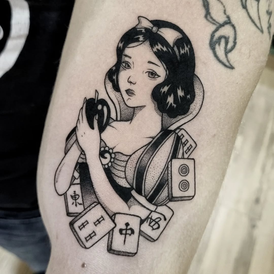 This tattoo showcases Snow White in a unique, artistic style, blending classic Disney charm with contemporary flair.
