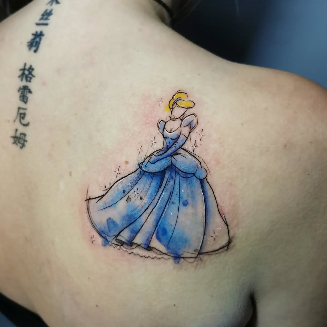 This delightful tattoo features Cinderella in a whimsical watercolor style.