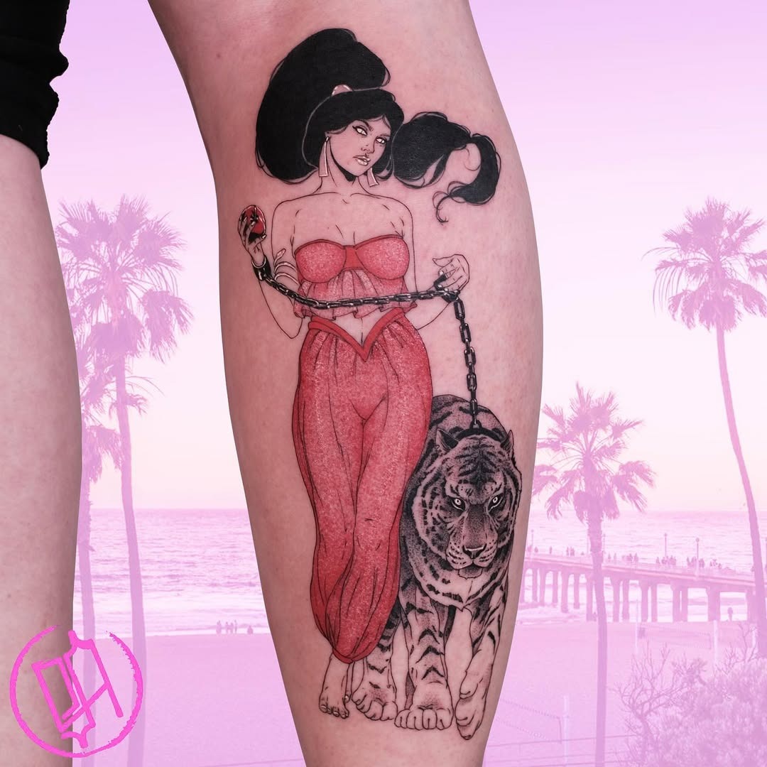 This stunning tattoo features Jasmine, a beloved Disney princess, holding a majestic tiger on a leash.