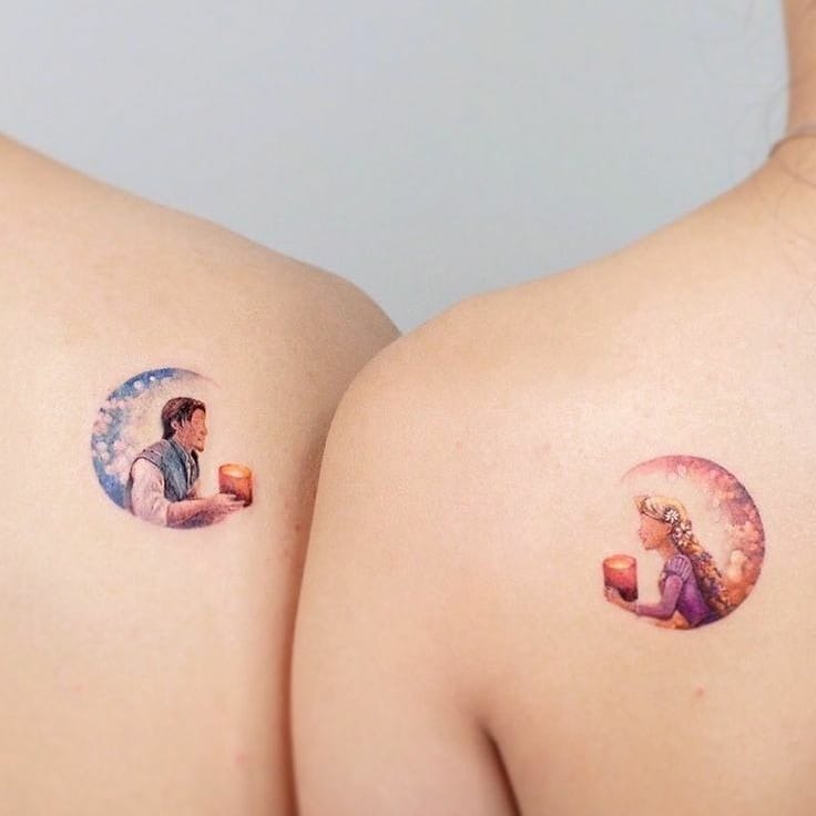 This beautiful tattoo showcases iconic characters from Disney's Tangled, with Rapunzel and Flynn holding lanterns.