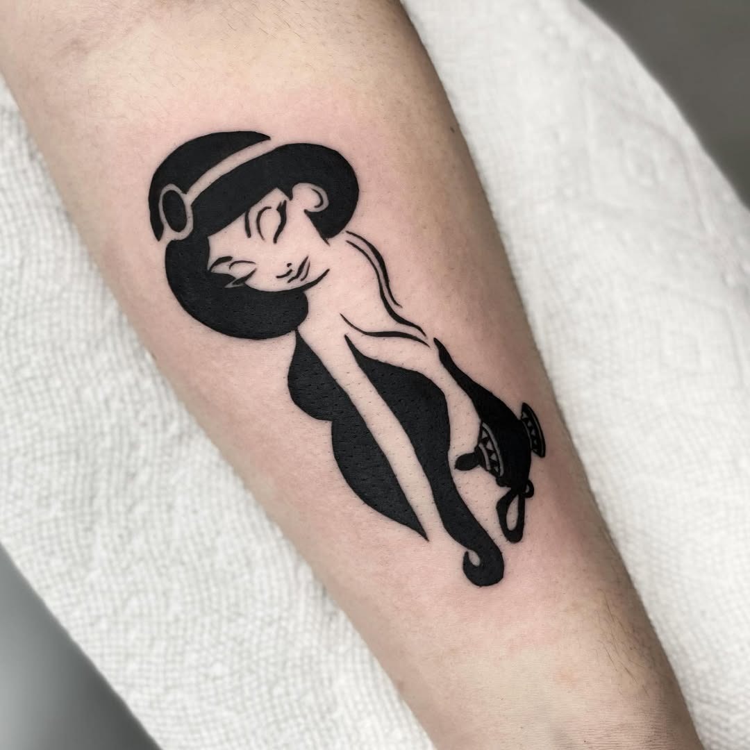 This tattoo showcases a sleek, minimalist design of a Disney princess.