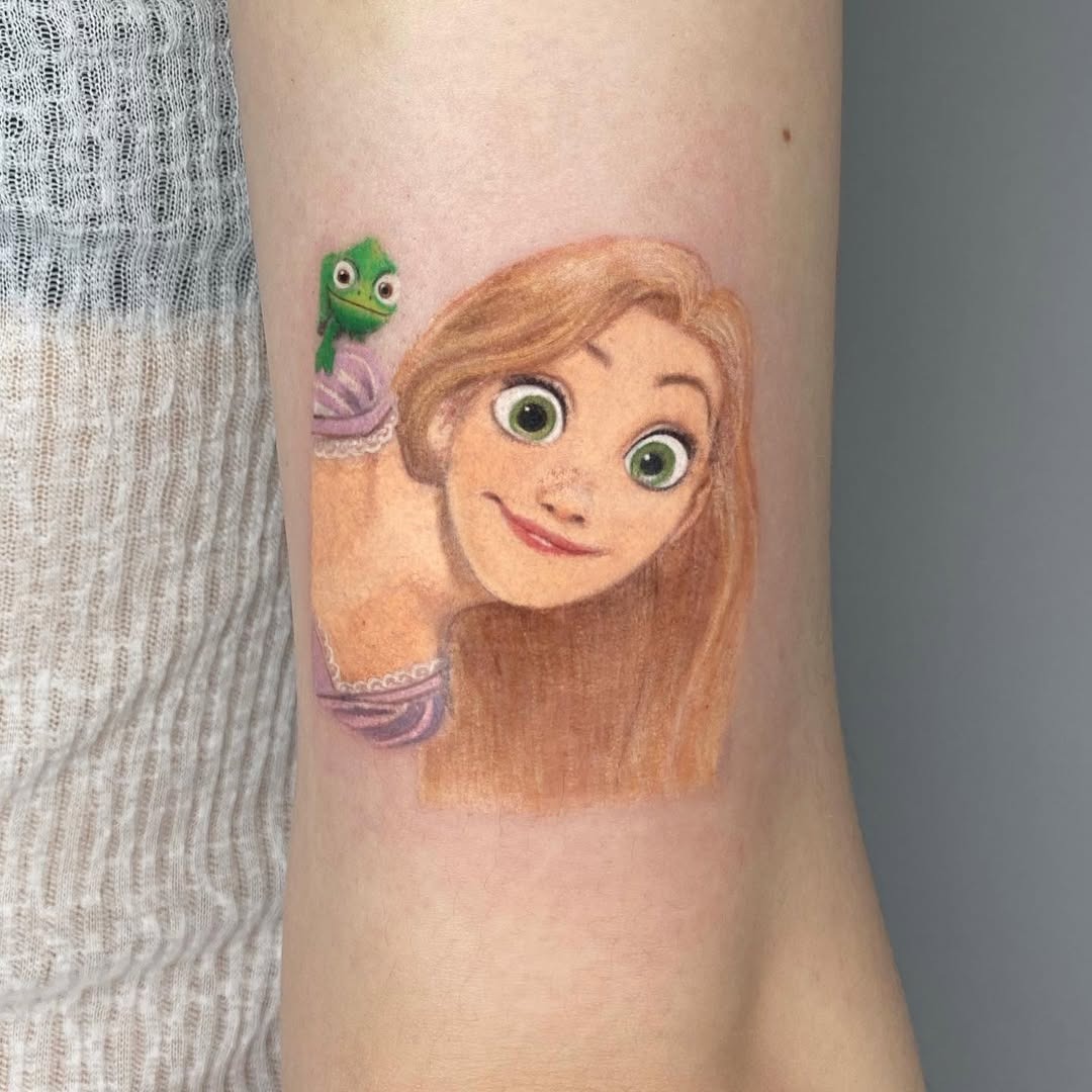 This stunning tattoo captures the joyful spirit of Rapunzel, complete with her loyal companion, Pascal.